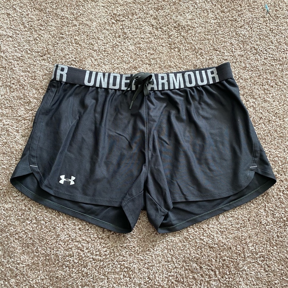 Under Armour charcoal gray athletic shorts.